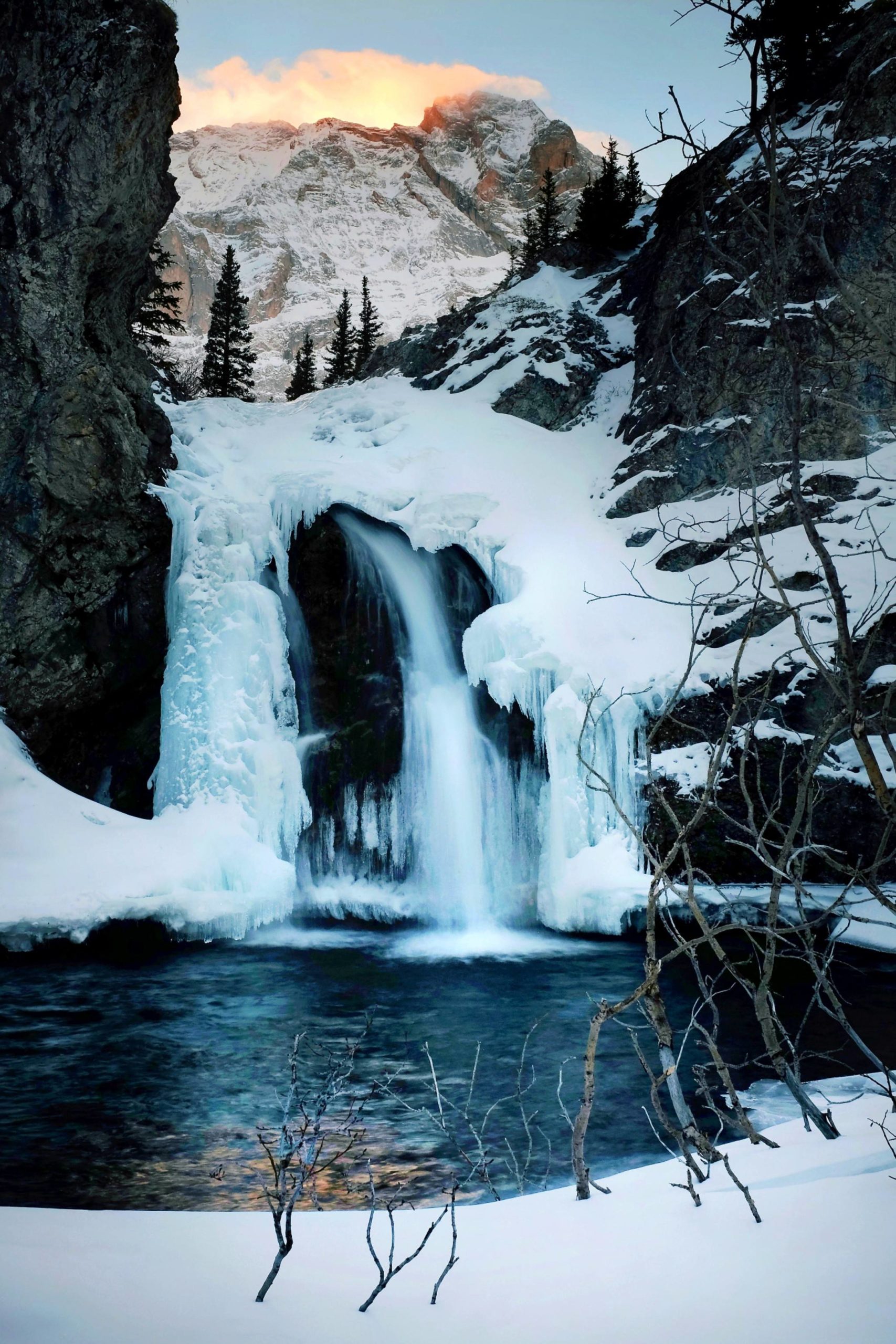 Hiked a few miles to see this half frozen waterfall up close and personal. Kananaskis Country, Alberta. 2153×3228 OC