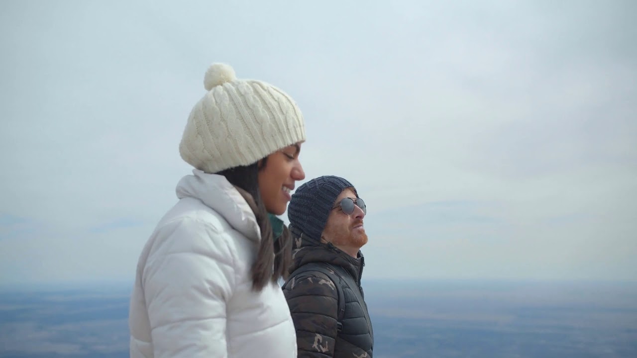 hiking above rocky mountains cinematic hiking shot on