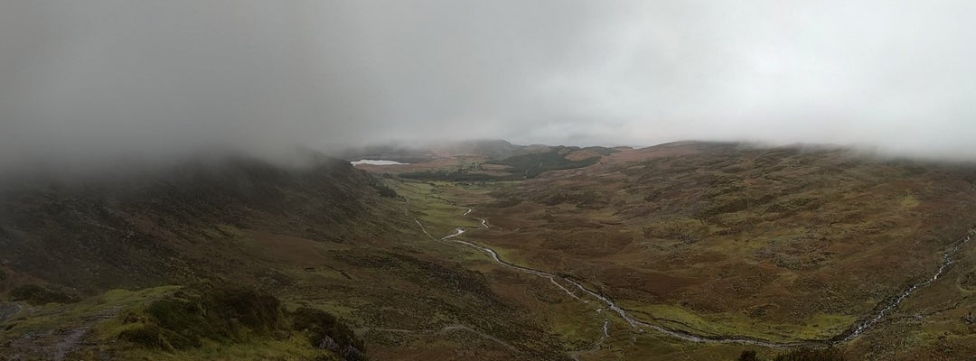 View of the Gearhanour stream and the Lough Acoose in the far end. From a mountain pass between Bridia Valley and Glencar on The Kerry Way trail. Co. Kerry Ireland