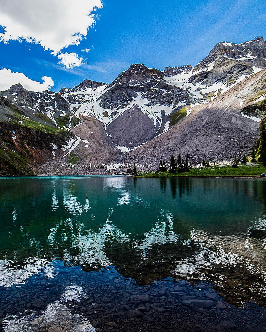 Friend invited me to do a hike in Colorado and we ran into this lake on the way to the summit. gorgeous lake on the slopes of Mt. Sneffels, Colorado.