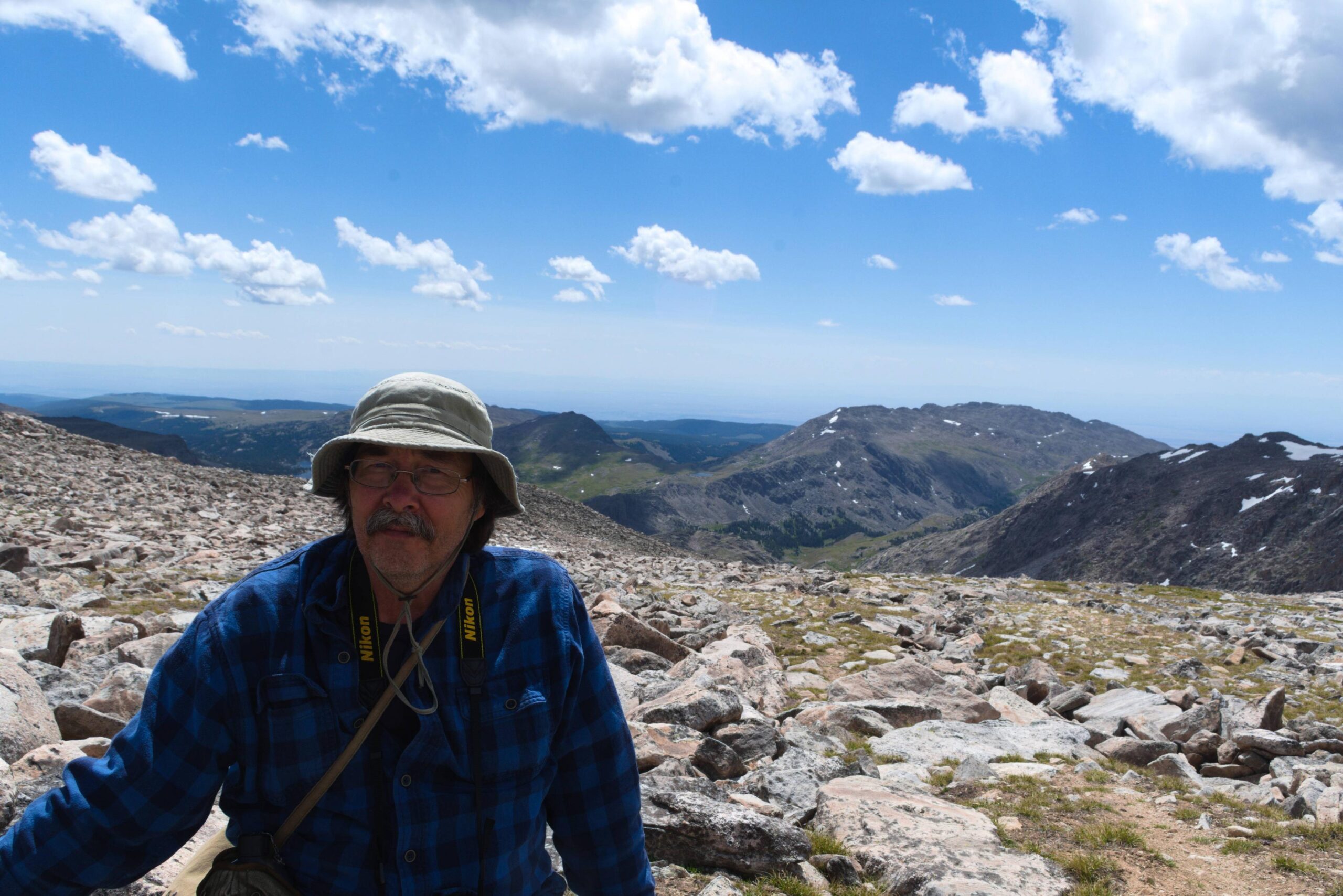 My 66-year-old and very exhausted dad after hiking up Cloud Peak,WY,13,000ft