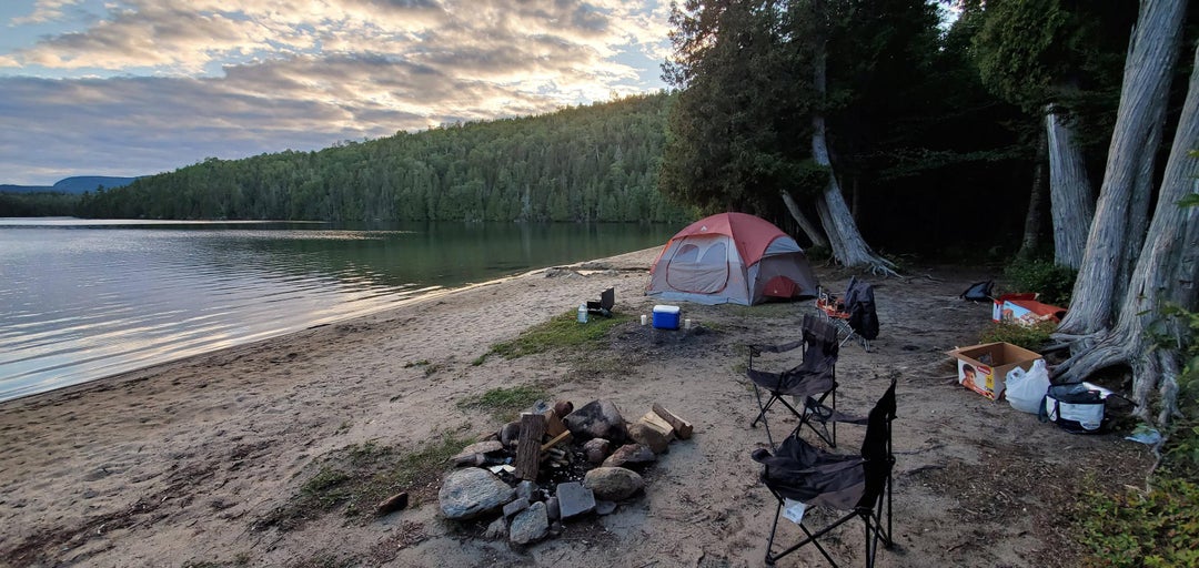 This is unknown beach in eastern canada. Water clear cold and clear as hell after a day of hiking Lacropole.